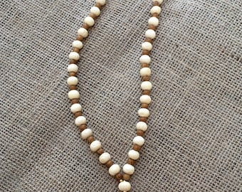 Ivory and wood beaded pink tassel necklace
