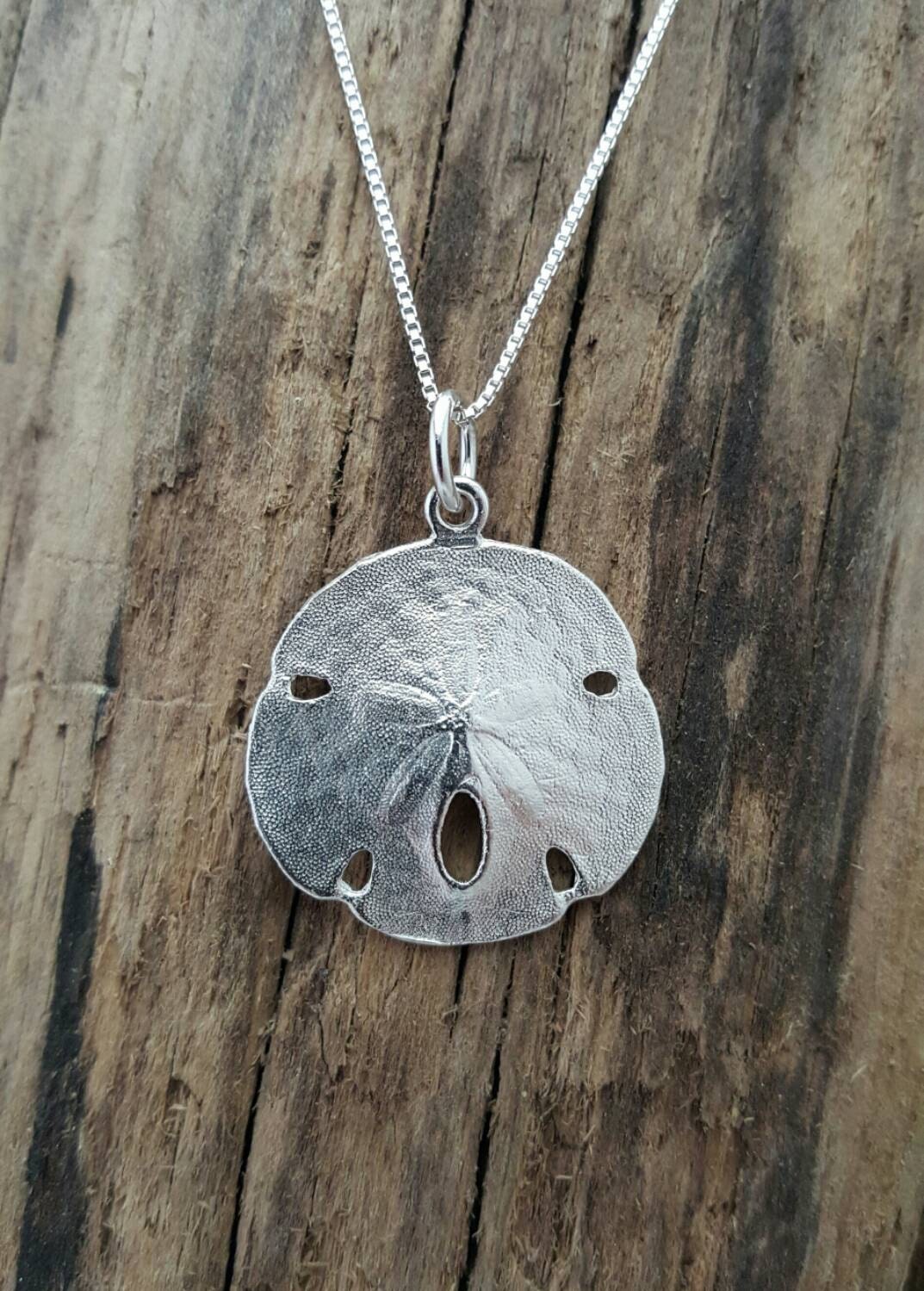 Sterling silver sand dollar pendant on an 18 inch sterling