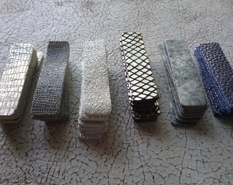 Die cut leather rectangles, 2 1/8 X 1/2 inch 48 total 6 patterns 8 of each, metallic accents. Great for leather crafts , leather earrings