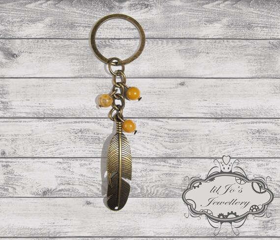Feather Key ring with Peach Beads. steampunk key ring, cosplay key ring, boho key ring, boho accessories, handbag dangle, handbag accessory.