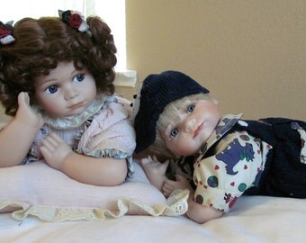 Sweet little ceramic girl and boy dolls