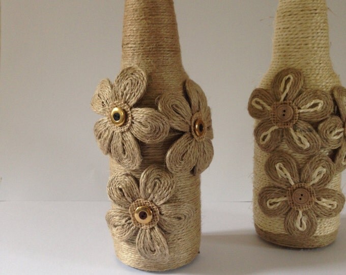 Twine wrapped recycled bottles with twine flowers, Christmas candle holders