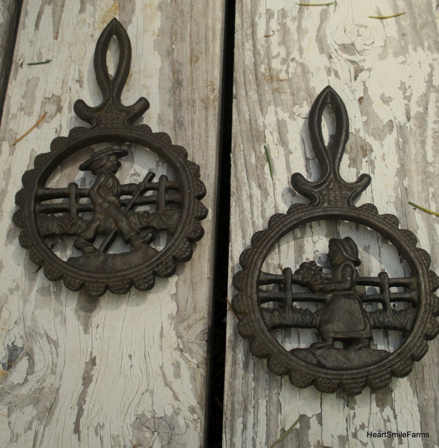 Set of Pennsylvania Dutch Boy and Girl Footed Trivets Cast Iron