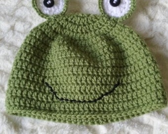 Green beanie hat in frog design for toddlers three to five years old