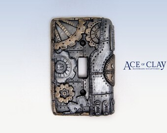 Steampunk Light Switch Cover. wall art sculpture installation decor decoration decorative art gifts handmade polymer clay sculpey gift gears