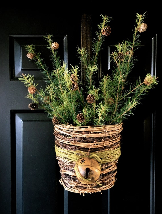 Holiday evergreen pine cone door hanger by WreathReimagined