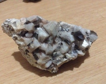 Smoky quartz points in microcline mineral specimen