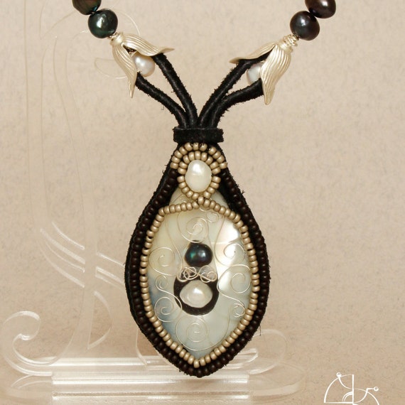 Modern classic. Pearl necklace, silver pendant, jewelry resin. Great fashion gift for her.