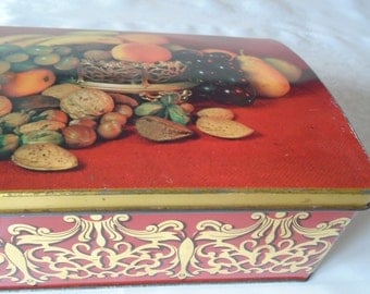 hinged tin box with silver plated wine coaster and fruit design.