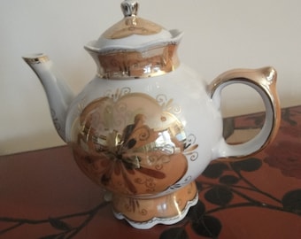 middle size TEA POT in cream with gold inlay from top to bottom really lovely