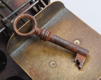 Antique rusty iron skeleton key. old patina