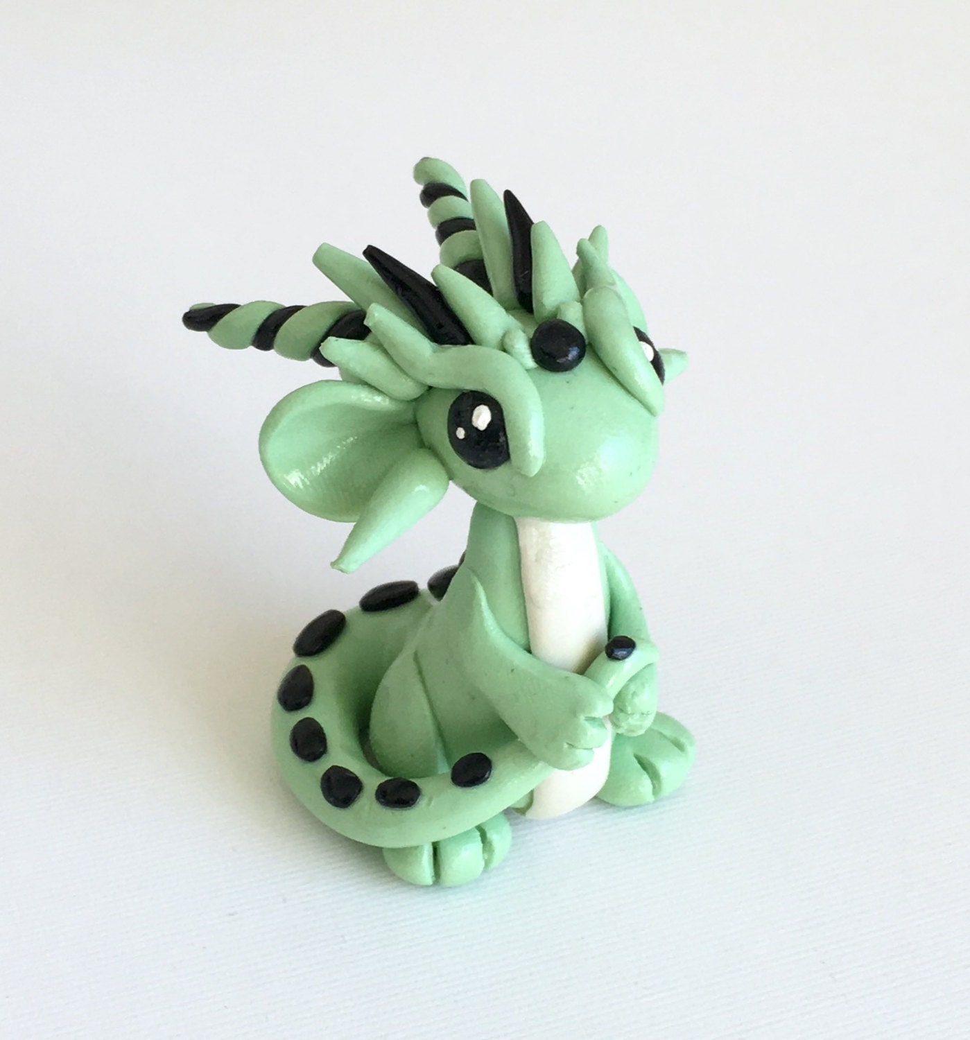 little green dragon figurines