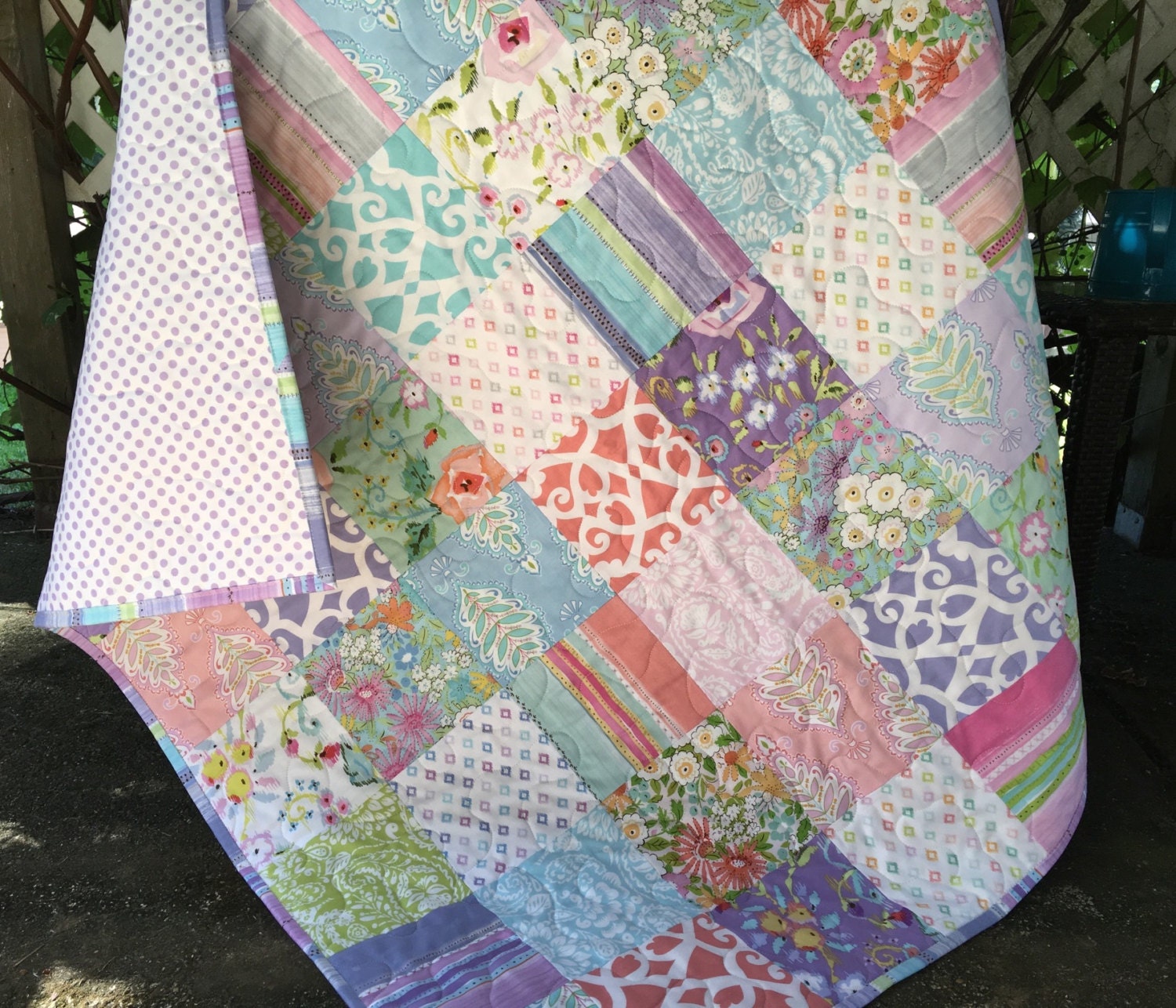 Baby girl quilt in coral mint green lavender pink and