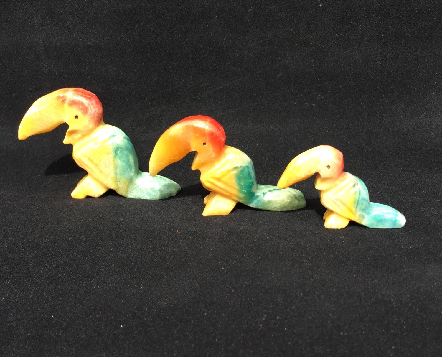 tropical bird figurines