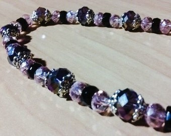 Beautiful crystal necklace in purple, black and pink. Sparkle!