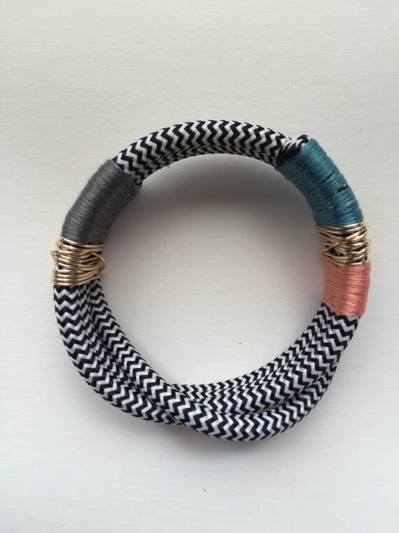 Items similar to Fisty Cuffs twisted cuff coral on Etsy