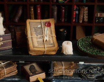 Miniature stack/ pile of very aged papers in 1/6 scale, 1:6 scale. Fantasy dollhouse miniatures. Faux wax seal, manuscripts, bundle, bunch.