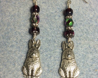 Large rabbit charm dangle earrings adorned with dark purple Czech glass beads.