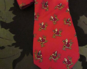 Men's Red Silk Holiday Tie with Santa riding a Reindeer by JOHN HENRY.