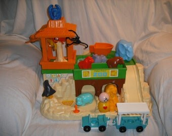 Vintage 1984 Fisher Price ZOO with accessories. Total of 19 pieces. Great Condition. PRICE LOWERED Lot# 135
