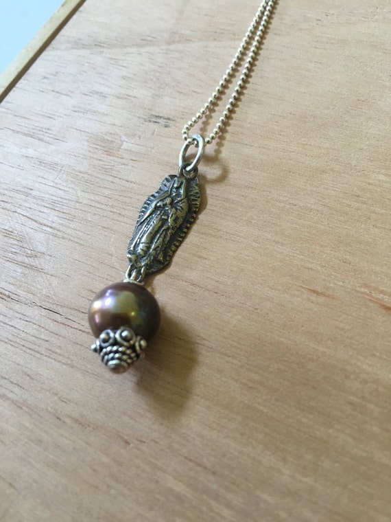 Bronze Our lady of Guadalupe with 'be love' on back with bronze pearl and Thai silver bead