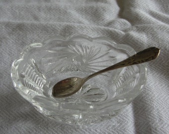 Vintage glass salt cellar with sterling silver spoon.