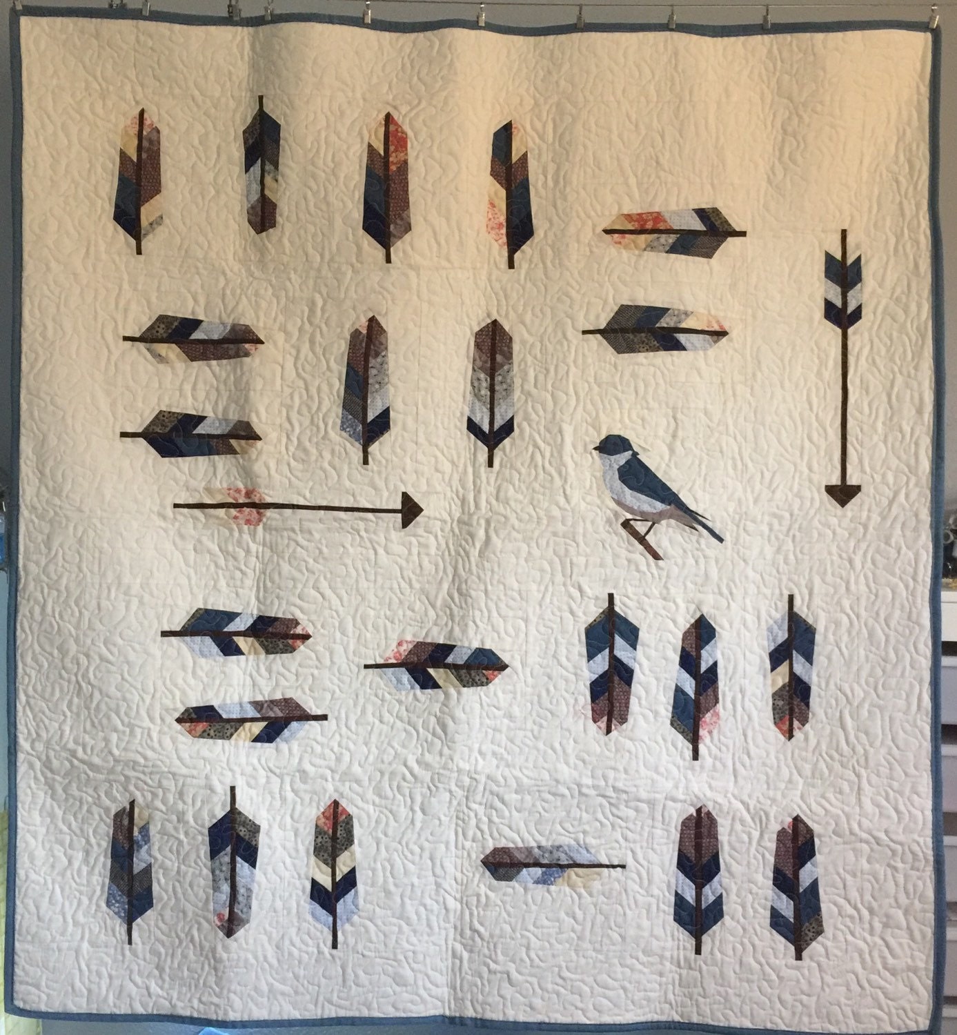 feathers-arrows-and-birds-lap-quilt