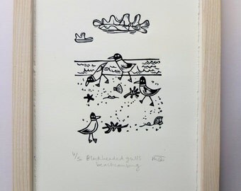 Black headed gulls beach combing - lino cut print