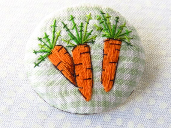 Art embroidery carrot button brooch on a by MargDierEmbroidery