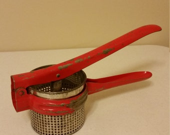 vintage potato ricer food strainer masher juicer - red metal by handy things company ludington mi - colander basket kitchen utensil decor