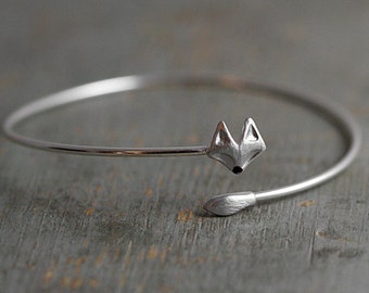 Delicate silver fox bangle. Fox head and tail. Hand patinated and enameled. Adjustable wrap bangle.