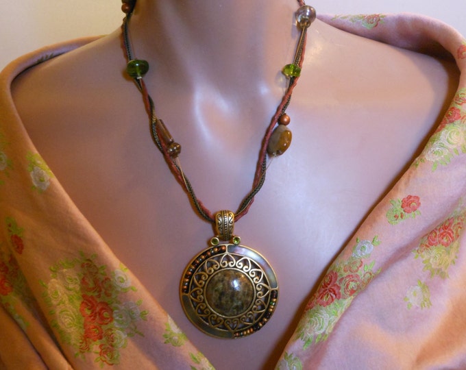 Chico's pendant necklace, large gold flecked green agate look pendant flanked with green rhinestones, three strand with stones necklace