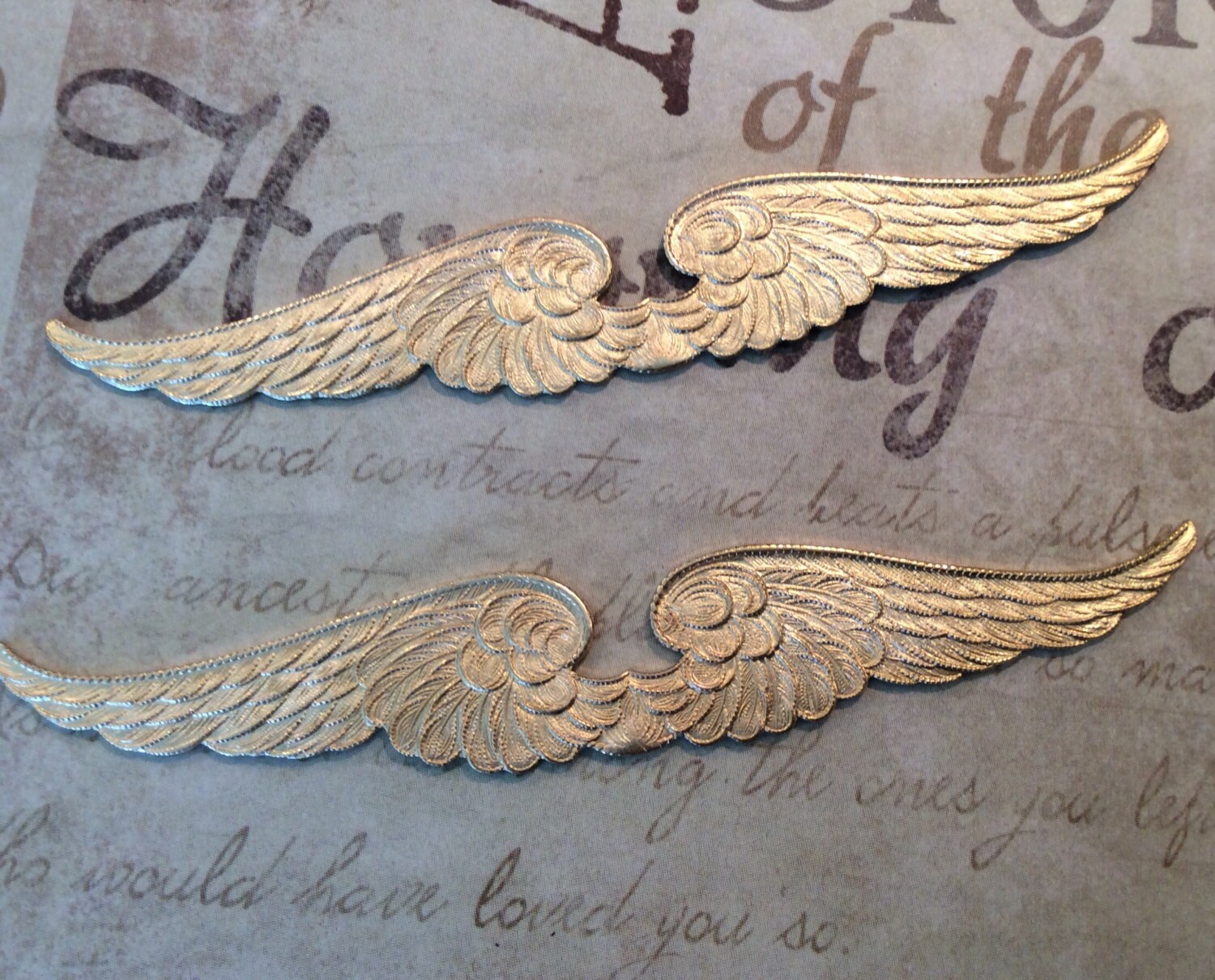 Raw brass steampunk angel wing flourish. 2 holes. 1 pc
