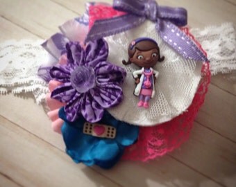 Fabric flower Doc McStuffins headband fascinator in purple and pink