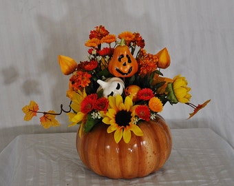 Halloween floral arrangement, pumpkin halloween arrangement, orange and yellow fall arrangement, jack o' lantern table arrangement
