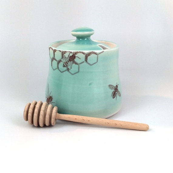 Green celadon glazed porcelain honey pot with bees buzzing and