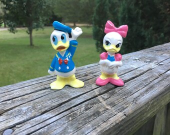 donald and daisy duck figurines