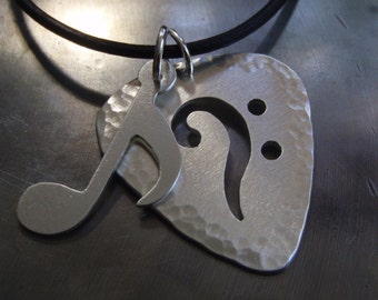 Bass Clef cut out guitar pick necklace in sterling silver with music note charm