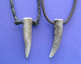 Deer Antler Necklace. Real deer antler tip on paracord. Choose your cord color, and plain or knotted cord style. Length is adjustable.