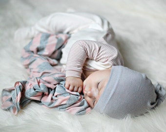 Baby girl swaddle blanket. Pink/ gray stripes. Soft and stretchy knit fabric. Size medium / 31 by 40 inches. Made by lippy brand.
