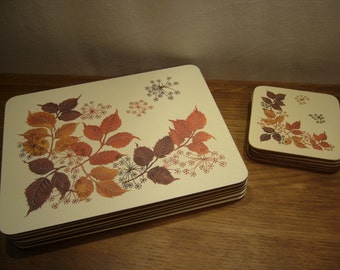 Vintage 1980s place mats and matching coasters with autumn leaves design, autumn leaves placemats and coasters