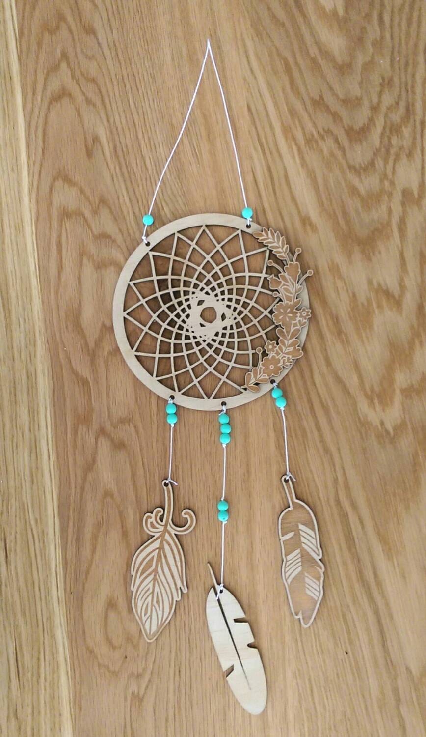 Dream catcher. Wooden dream catcher with feathers and beads.