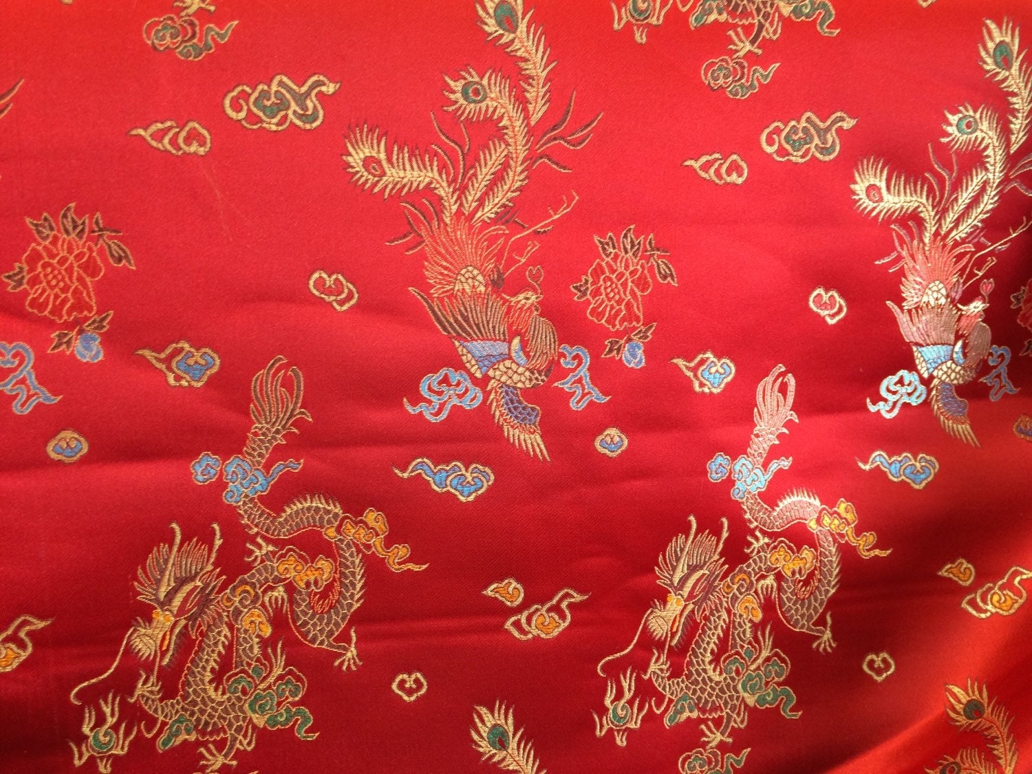 Dragon print design satin fabric red 45. Sold by the