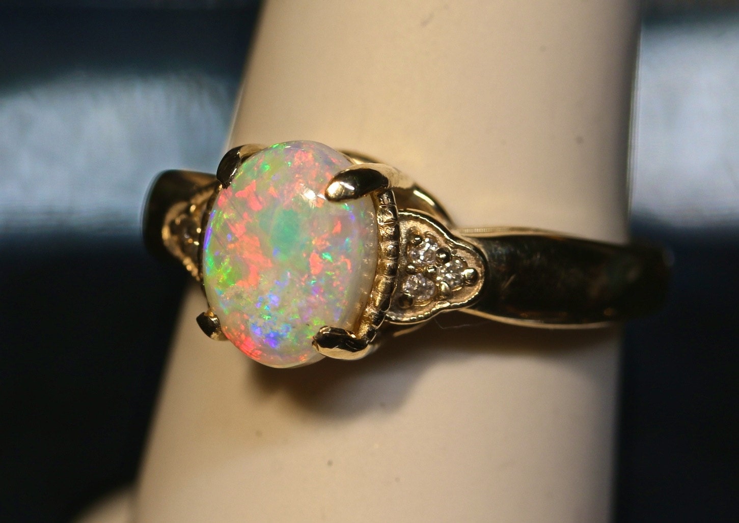 Antique style Opal Engagement ring with Diamond accents.