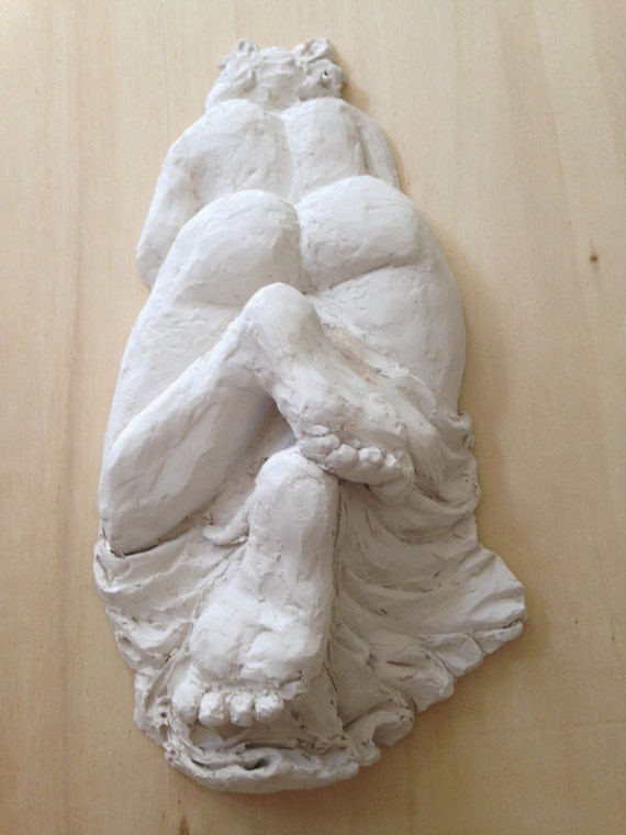 White wall sculpture Chic nude curvy girl laying woman in