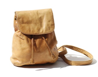 small tan leather backpack