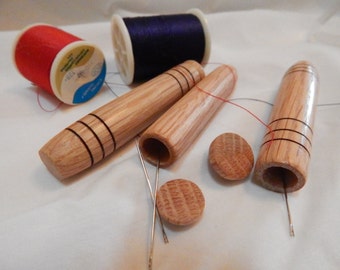 Wooden needle case hand turned from oak, tan to brown in color, pocket or purse sized