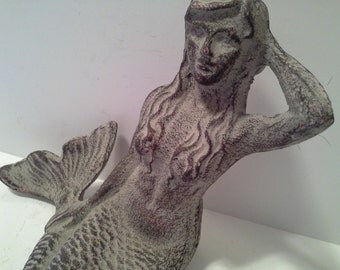 Great doorstop.....metal mermaid, cast iron