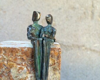 PETITE BRONZE LOVERS >> Romantic miniature bronze sculpture made in Santa Fe, New Mexico by Yenny Cocq Mounted on rustic travertine or onyx