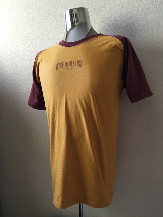 mustard yellow nike shirt